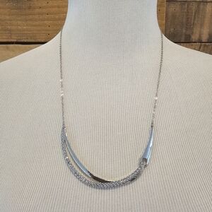 Silvertone and rhinestone abstract swoop necklace